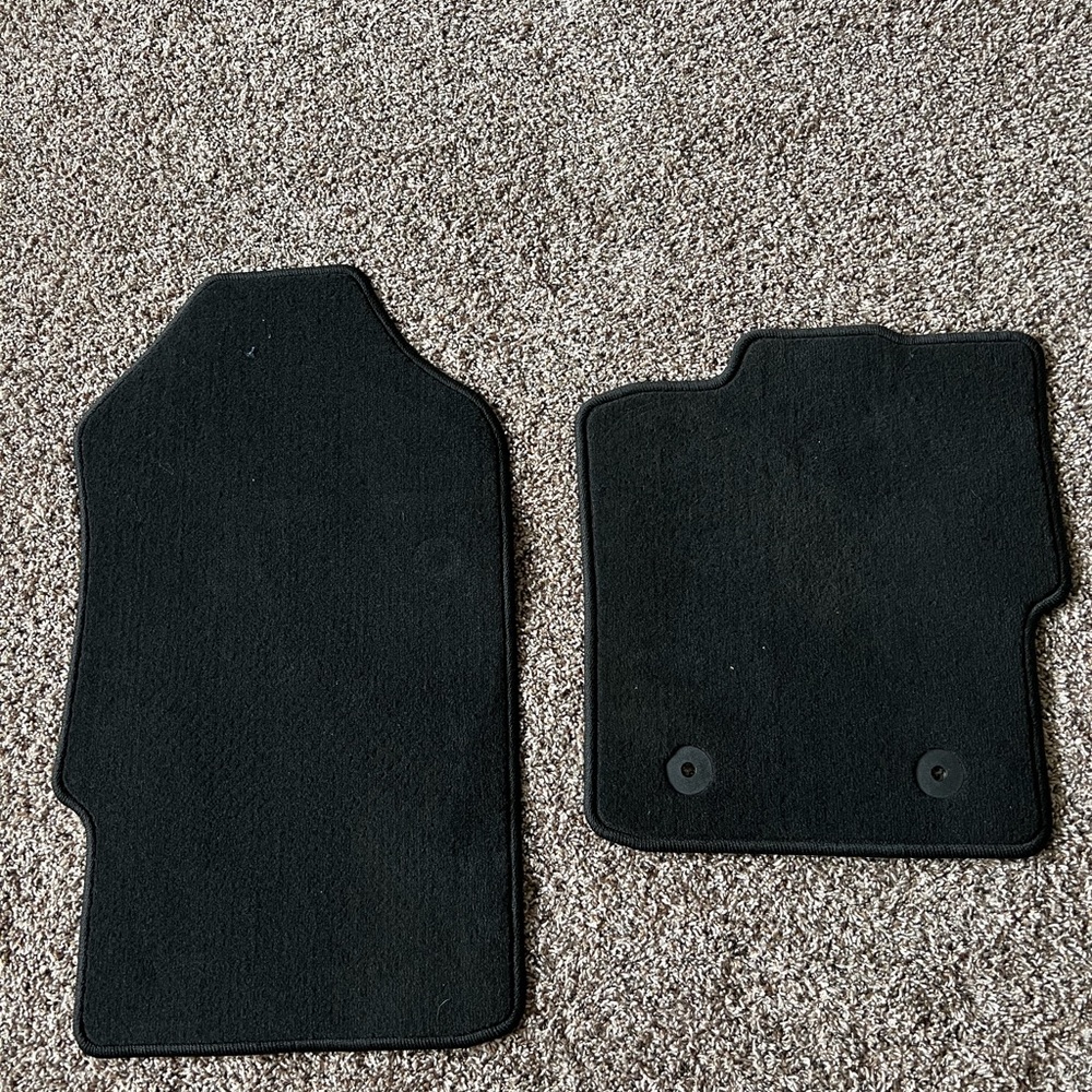 Brand new Ford Ranger carpet floor mats with teeth on the backside.